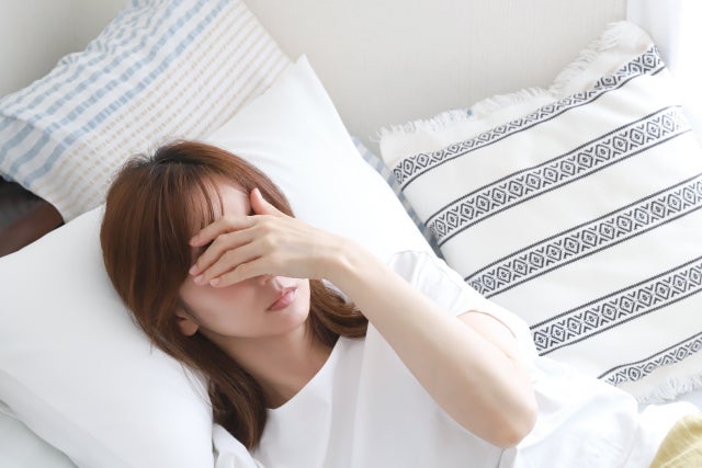 体調不良の女性